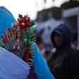 A pilgrim totes a statue of the Virgin of Guadalupe -- Mexico's City's patroness -- on his back