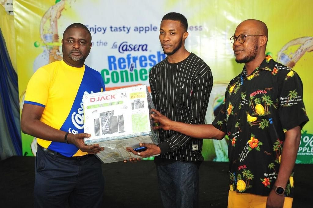 L-R: La Casera Dealer in Ibadan, Alhaja Adenekan Kudirat Wunmi of Dalec Store; iPhone X star prize winner, Oladapo Tunde Joshua and the Managing Director, The La Casera Company, Chinedum Okereke; at the Ibadan Grand Draw of the La Casera Refresh & Conn...
