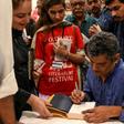 Author Mohammed Hanif signing copies of his book "A Case of Exploding Mangoes" in Islamabad in September 2019 after the release of its Urdu translation

Featuring bumbling generals, assassination plots, and homosexual romance, Pakistani military satire...