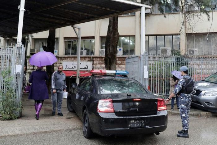A police car enters the prosecutor's office in Beirut where fugitive former auto magnate Carlos Ghosn was summoned for questioning