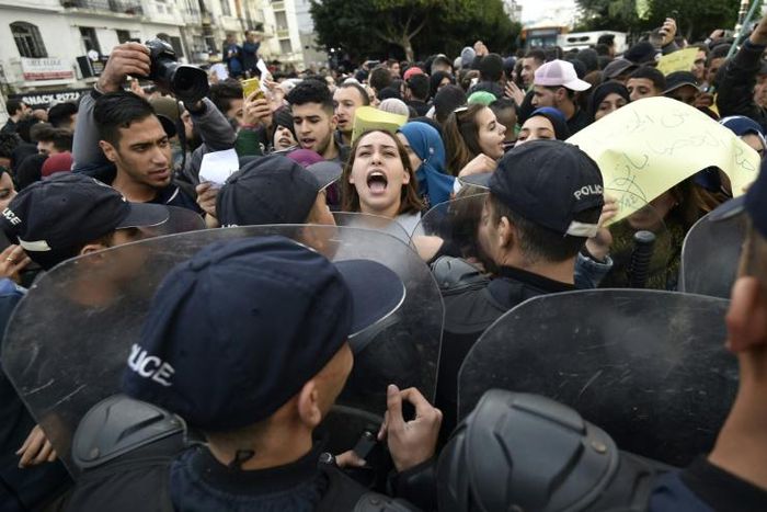Some 200 people, mostly students, protested in central Algiers on Monday against a presidential election set for December 12