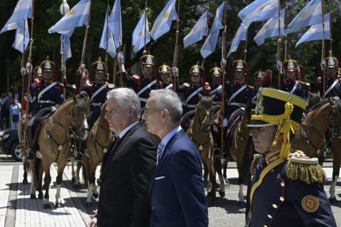 Cuban President Miguel Diaz-Canel (L) takes part in a wreath-laying ceremony to pay homage to Argentine national hero General Jose de San Martin, at San Martin Square in Buenos Aires on Monday