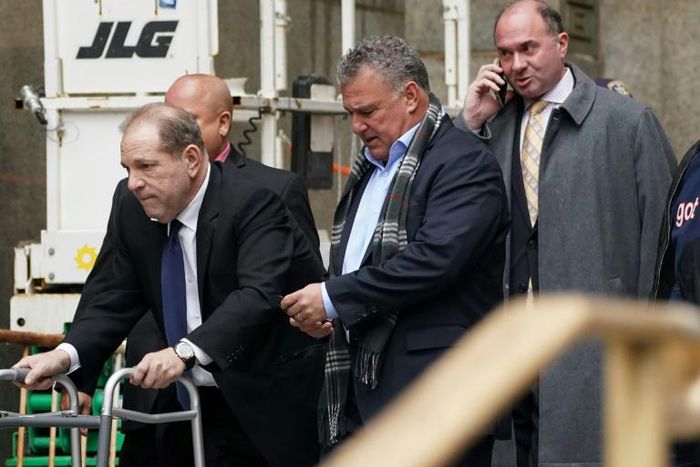 Disgraced Hollywood mogul Harvey Weinstein leaves a court hearing in New York using a walking frame