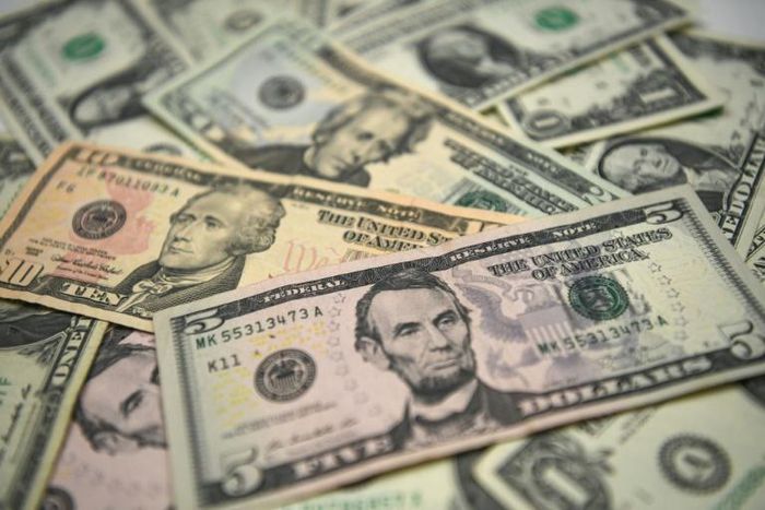 US bank notes. The bank robber reportedly shouted 'Merry Christmas' and threw the stolen cash in the air