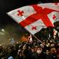 Opposition supporters have staged a series of mass rallies in the capital Tbilisi after the ruling party voted down legislation to hold next year's elections under a new proportional voting system
