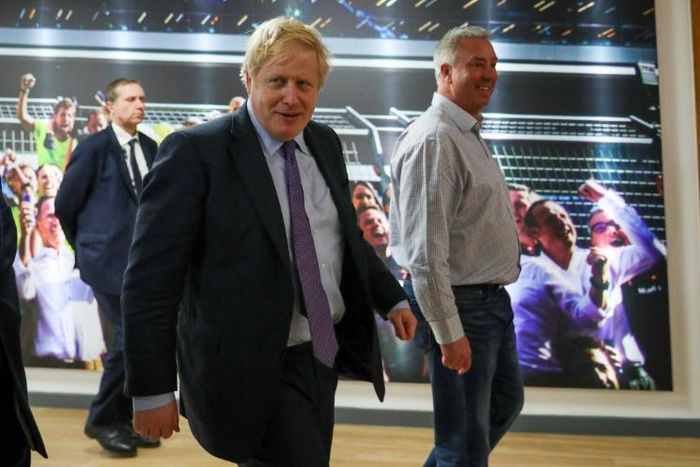 Britain's Prime Minister Boris Johnson during a Conservative Party general election campaign visit to Red Bull Racing in Milton Keynes. Feeling confident he has already published his plans for his first 100 days in office