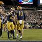 The Navy Midshipmen celebrate a touchdown in Saturday's game against the Army Black Knights