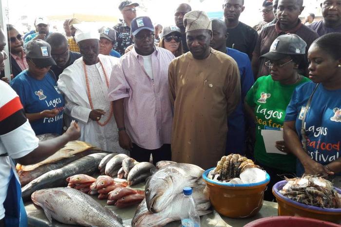 The Deputy Governor of Lagos State, Dr Obafemi Hamzat (3rd from right) and other top government officials taking a tour of fish stands at the 2019 Fish Festival in Lagos on Sunday. (NAN photo)