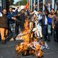 Activists protest against the rape and murder of a 27-year-old woman in India. Police later shod dead the four detained suspects as they re-enacted the crime
