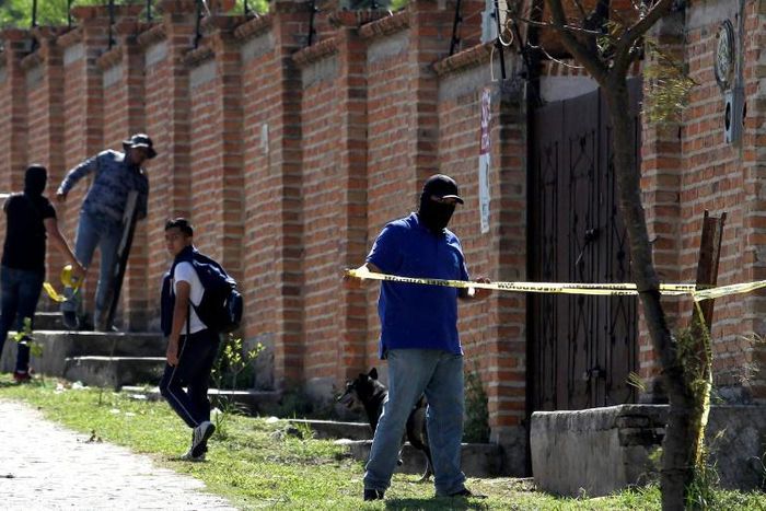 Authorities at work in  the El Mirador neighborhood of Tlajomulco de Zuniga in Jalisco, Mexico, where the remains of at least 50 people were found in a mass grave