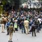 Students and their supporters face off against police outside the Jawaharlal Nehru University gate in New Delhi
