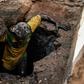 Return to light: Wendgoundin Sawadogo climbs back up after emptying a latrine in Ouagadougou