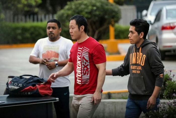 Kenji Fujimori (C), is pictured in Lima on February 22, 2019 after visiting his father, ex-president Alberto Fujimori