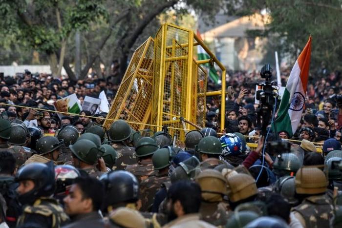 Protesters scuffle with police outside after a suspected Hindu nationalist  live-streamed himself minutes before opening fire on university students protesting against India's new citizenship law