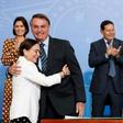 Brazil's President Jair Bolsonaro being hugged by actress Regina Duarte, Brazil's new culture secretary