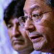 Former Bolivia president Evo Morales (in the background) and presidential candidate Luis Arce face a race against time to register for May's general election