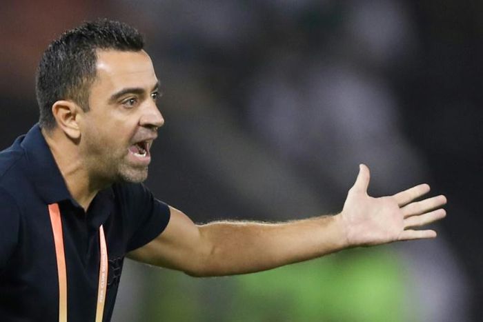 Sadd's coach Xavi speaks to his players during the 2019 FIFA Club World Cup quarter-final football match between Monterrey and al-Sadd at Jassim Bin Hamad Stadium in Doha on December 14, 2019.