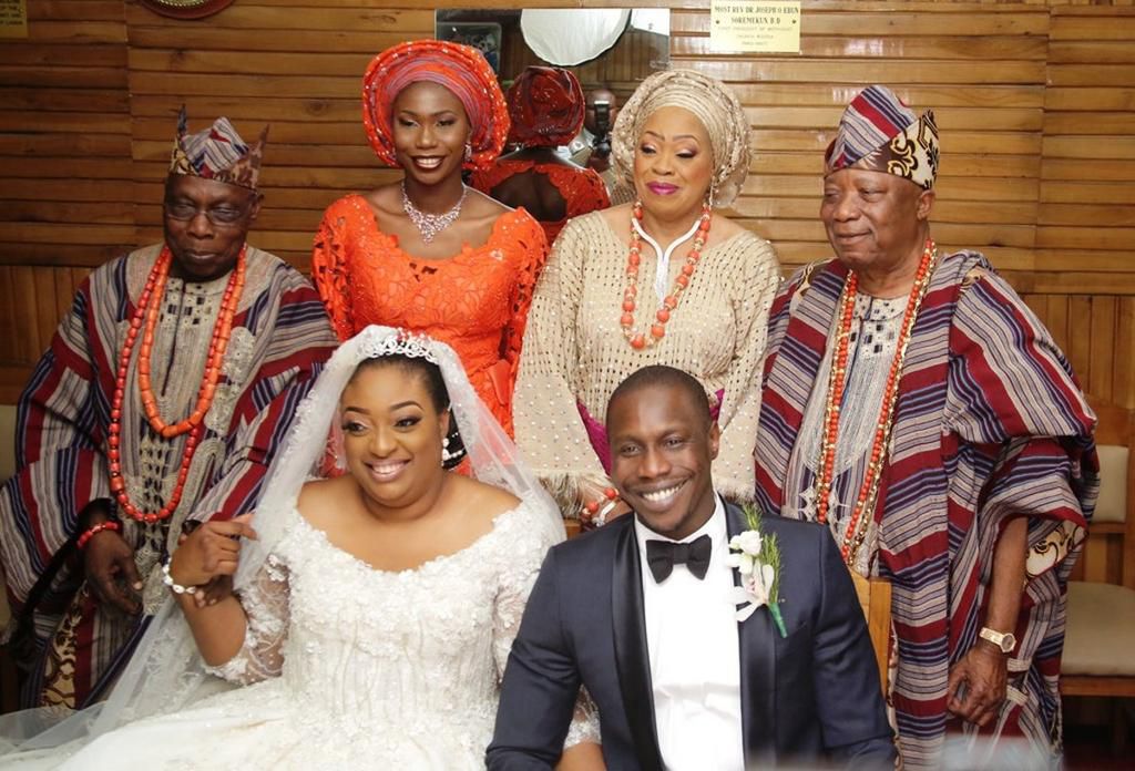Olujonwo Obasanjo and Tope Adebutu and their parents on their wedding day (Laila)