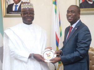 L-R: Lagos State Deputy Governor, Dr Obafemi Hamzat, presenting a souvenir to the Chairman, Senate Committee on ICT and Cybercrime, Senator Yakubu Oseni in Ikeja on Thursday