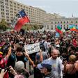 Chileans march against police repression outside the presidential palace