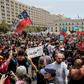 Chileans march against police repression outside the presidential palace