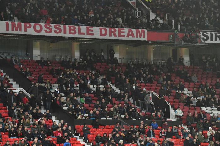 No hope: Manchester United fans left early during Wednesday's 2-0 defeat to Burnley