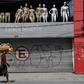 A homeless walks past a closed parking lot and mannequins in downtown Sao Paulo, Brazil, after the city government decreed the closure of shops and stores as a precautionary measure against the spread of the novel coronavirus COVID-19, on March 24, 202...
