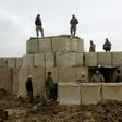 Afghan security forces stand guard at an Afghan National Army (ANA) outpost after an attack by Taliban militants, in Kunduz province on March 4, 2020, following a peace deal with the United States