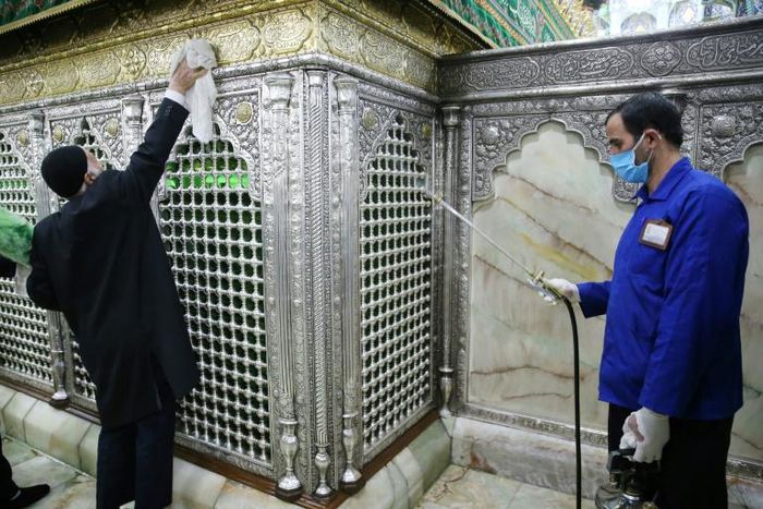 Iranian sanitary workers disinfect the revered Masumeh shrine in the Shiite holy city of Qom, which has been the epicentre of the COVID-19 outbreak in the Islamic republic