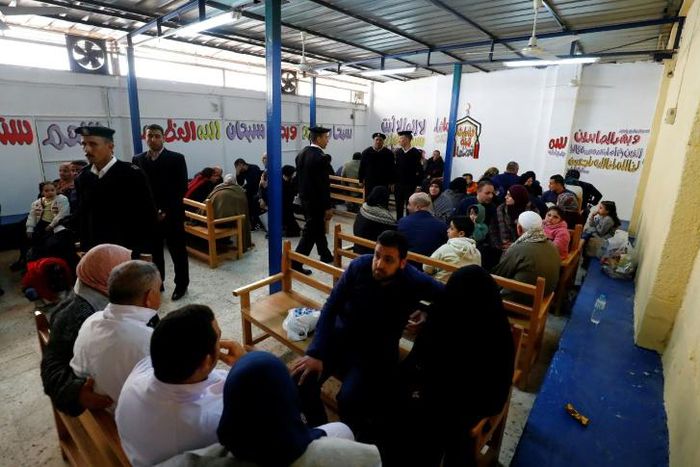 Prisoners meet with relatives during visiting hours at Cairo's Tora prison