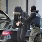 Prosecutors said Friday they had launched early morning raids to determine whether the suspects already had weapons or other supplies that could be used in an attack