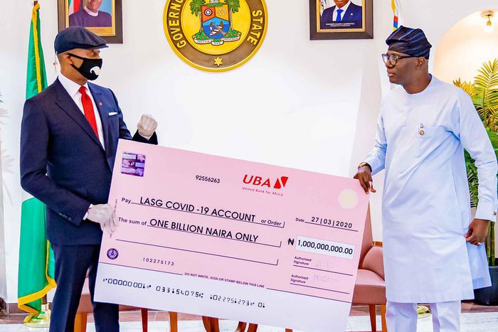 Donation to Lagos 1: UBA Supports Lagos State in Fight Against COVID-19 . Group Managing Director/CEO, United Bank for Africa(UBA), Mr, Kennedy Uzoka presenting a cheque of N1 billion to Governor of Lagos State, Mr. Babajide Sanwo-Olu, as part of the B...