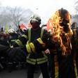 Some firefighters wearing special protective vests set fire to themselves