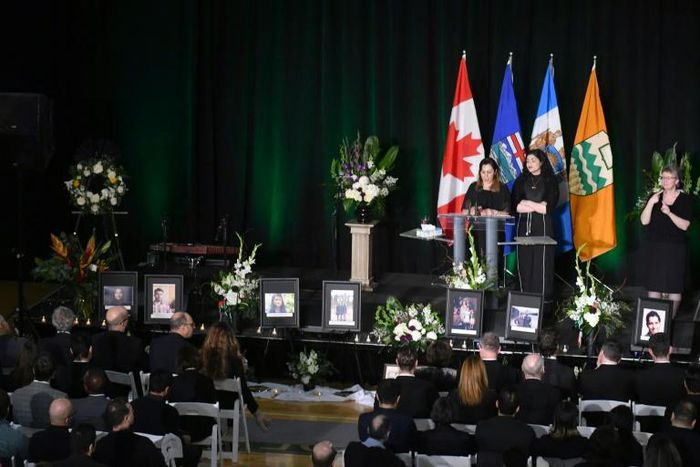 Mourners speak on stage during a memorial service for the victims of Ukrainian Airlines flight PS752 crash in Iran