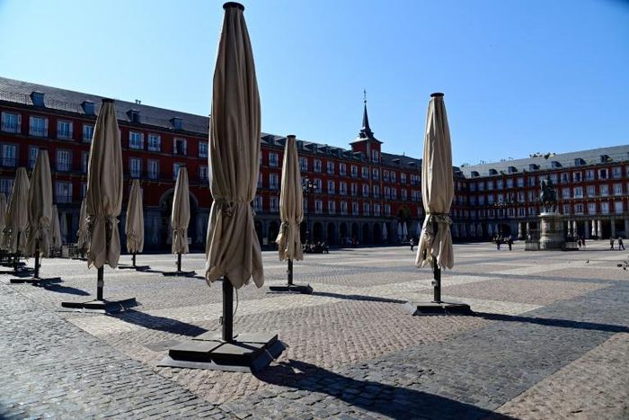 Public spaces such as the Plaza Mayor in central Madrid have already largely emptied
