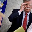 John Bolton's revelations came as White House lawyers prepared to resume their defense of President Donald Trump (pictured left)
