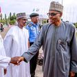 President Muhammadu Buhari (right) shakes hands with his Chief of Staff, Abba Kyari (left) [Presidency]