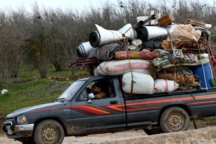 In a call with his Turkish counterpart, Trump voiced concern at violence in Idlib, Syria; a truck loaded with furniture passes an internally-displaced persons (IDP) camp  February 16, 2020, as people flee advancing Syrian government forces in Idlib and...
