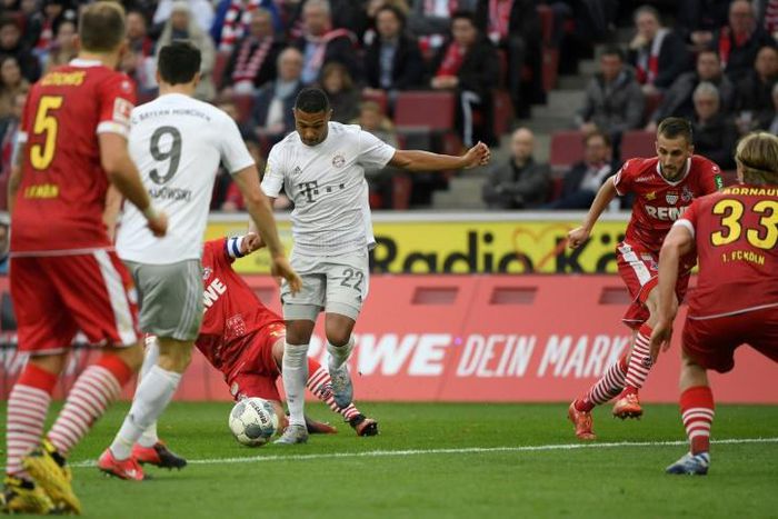 Serge Gnabry (C) scored two goals in Bayern Munich's 4-1 win at Cologne which left the defending champions a point clear at the top of the Bundesliga on Sunday.