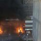 A picture shows vehicles and bins burning near the Gare de Lyon rail station in Paris on February 28, 2020; police said they tried to stop protesters who set alight garbage bins and scooters
