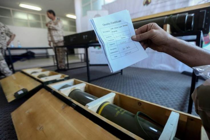 Fighters loyal to Libya's UN-recognised government display Chinese-made shells bearing the markings of the United Arab Emirates, reportedly seized from Haftar's forces, in June 2019