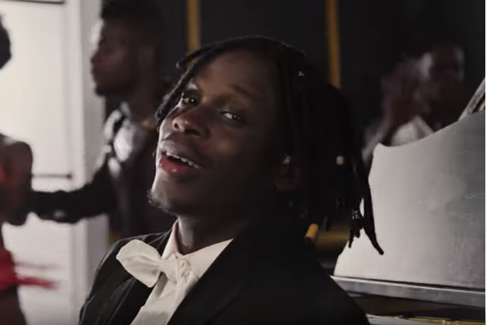 Fireboy is a ballroom dancer in video for, 'Vibration.' (YouTube/Fireboy)