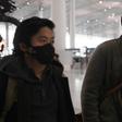 Wall Street Journal reporters Philip Wen (left) and Josh Chin walk through Beijing Capital Airport on their way out of China