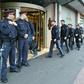 Police officers close a hotel near the city centre in Innsbruck on February 25 after a woman who worked there was confirmed to have coronavirus