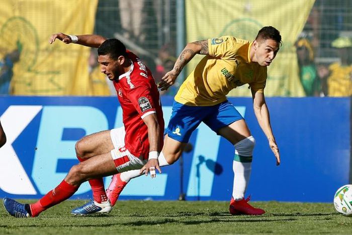 Mamelodi Sundowns forward Jose Ali Meza (R) slips past Al Ahly defender Ramy  Rabia during a CAF Champions League quarter-final second leg in Pretoria Saturday