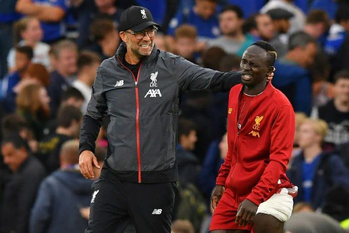 No Mane, more problems: Liverpool manager Jurgen Klopp (left) could be without Sadio Mane (right), Mohamed Salah and Naby Keita for several weeks next season