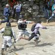 Mexican National Guards tackle migrants who   crossed the Suchiate River from Guatemala on January 20, 2020