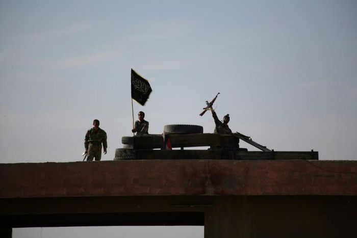 A Syrian youth brandishes his weapon during a last training before being sent to the frontline along with rebel fighters from the Jaysh al-Islam brigades (Army of Islam) in Eastern al-Ghouta in 2014