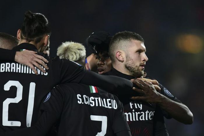 AC Milan's Ante Rebic (R) celebrates after scoring the winner against Brescia