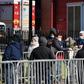 New Yorkers queue outside Elmhurst Hospital Center in Queens to get tested for the coronavirus